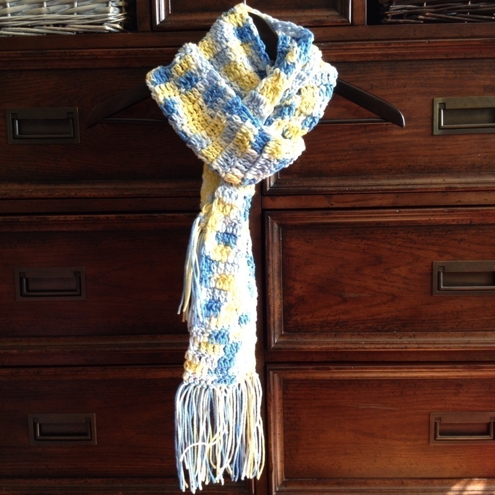 Handmade blue, yellow, and white knitted scarf